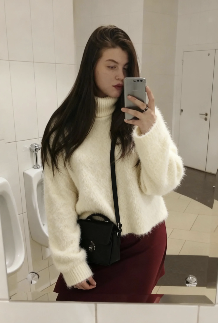 AI virtual try-on result with the client wearing a sweater